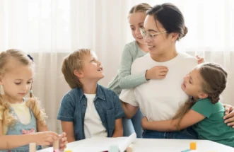 front-view-kids-hugging-their-teacher1769200031